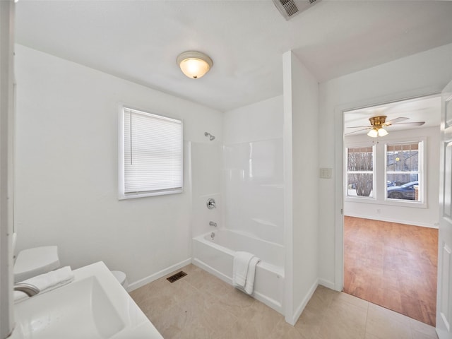 full bathroom with shower / washtub combination, tile patterned flooring, visible vents, and toilet