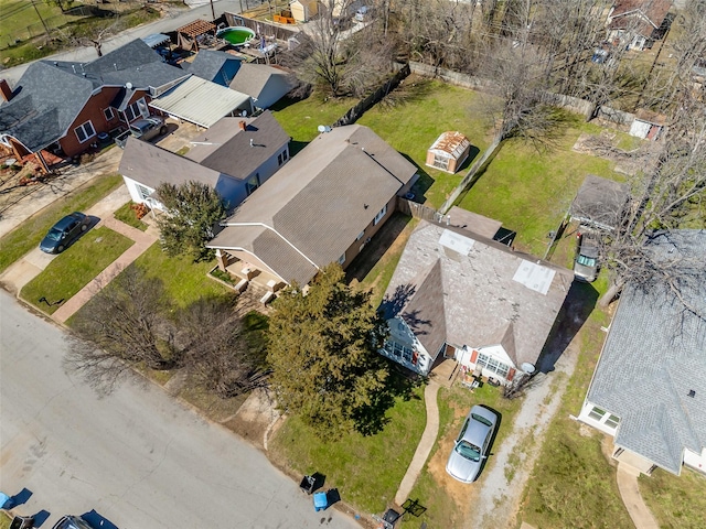 birds eye view of property with a residential view