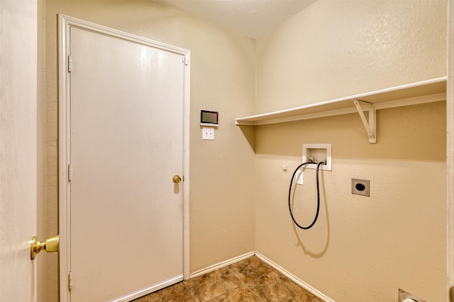 laundry area featuring laundry area, baseboards, washer hookup, and electric dryer hookup