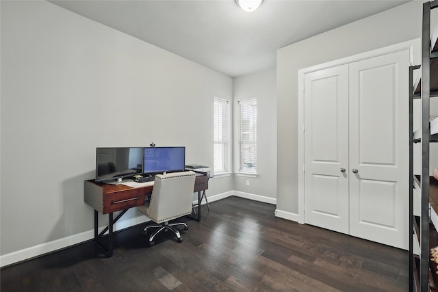 home office with baseboards and dark wood-style flooring