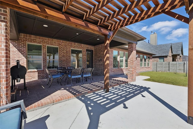 view of patio / terrace with a pergola and fence