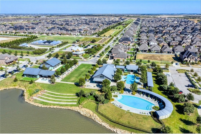 birds eye view of property featuring a residential view and a water view