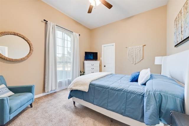 carpeted bedroom featuring a ceiling fan and baseboards