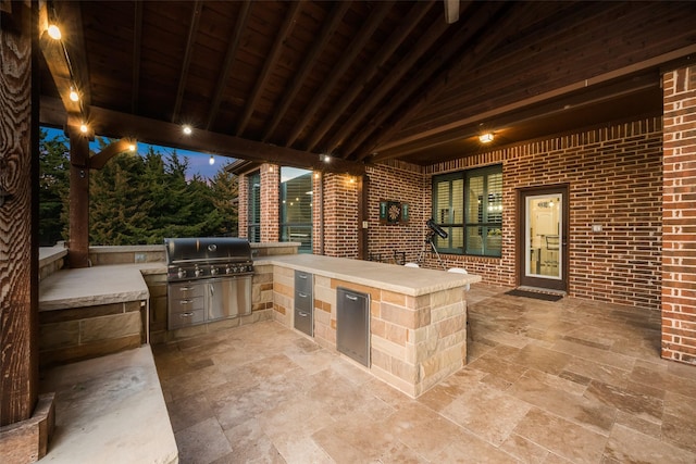 view of patio with exterior kitchen and grilling area