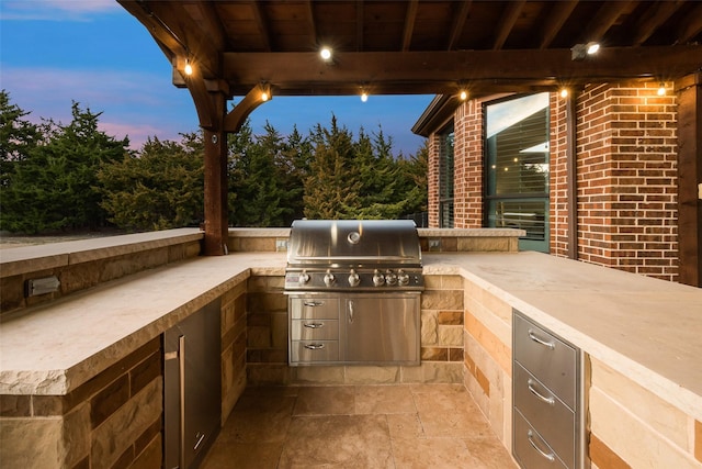 view of patio with exterior kitchen and grilling area