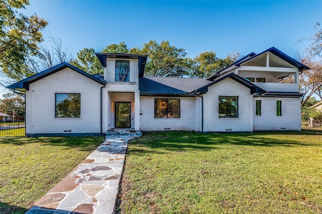 view of front of property with brick siding, crawl space, a front lawn, and fence