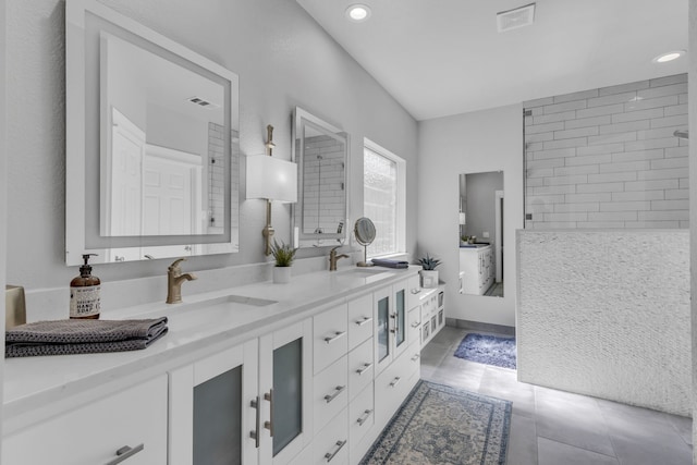 full bath with tile patterned floors, visible vents, a sink, and double vanity