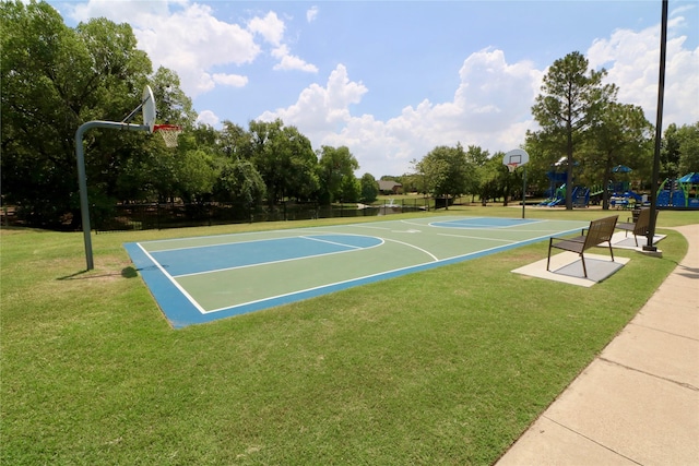 view of basketball court featuring community basketball court, playground community, and a yard