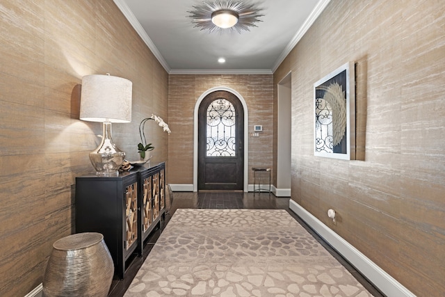 foyer with dark wood-type flooring, baseboards, arched walkways, and crown molding