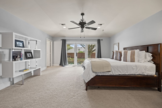 carpeted bedroom featuring access to exterior, lofted ceiling, visible vents, and baseboards