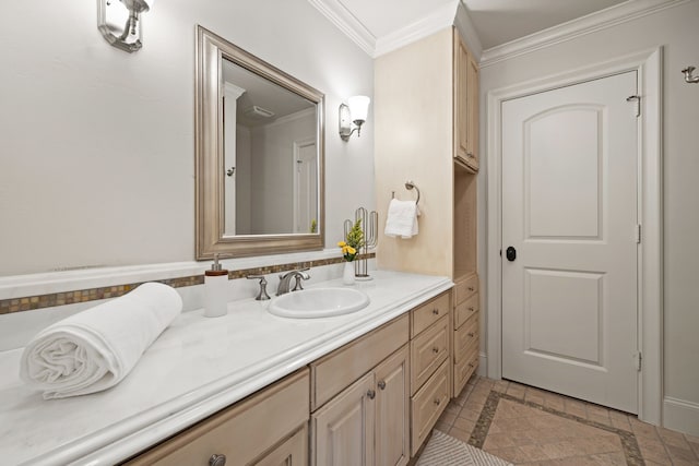 bathroom featuring ornamental molding and vanity