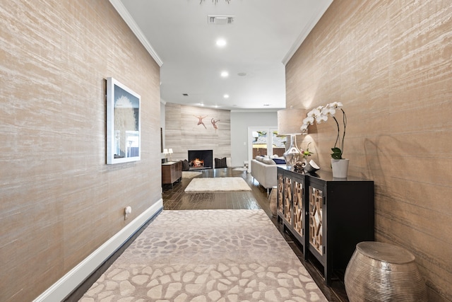 hall featuring recessed lighting, dark wood-style flooring, visible vents, baseboards, and ornamental molding