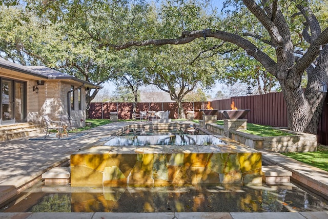 view of swimming pool featuring a fenced backyard