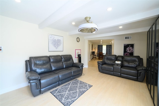 living area with recessed lighting, visible vents, light wood-style floors, beamed ceiling, and baseboards