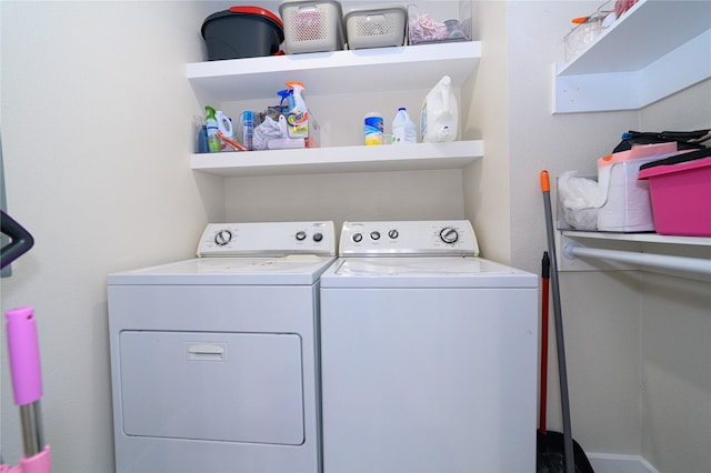 laundry room with laundry area and washing machine and clothes dryer