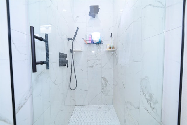 full bathroom featuring a marble finish shower