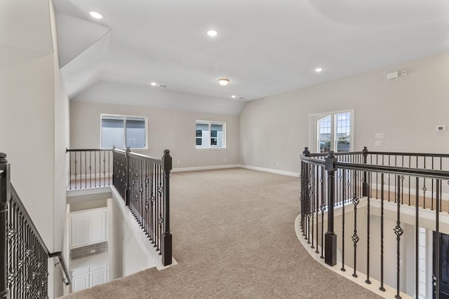 hall with lofted ceiling, recessed lighting, carpet flooring, an upstairs landing, and baseboards