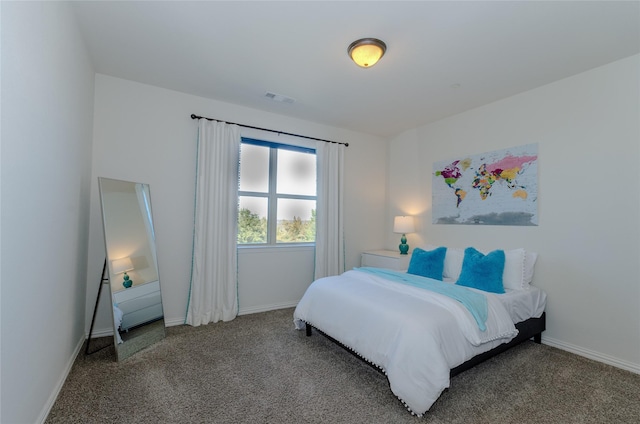 bedroom with baseboards, visible vents, and carpet flooring