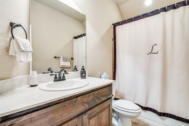 bathroom with a textured wall, vanity, toilet, and shower / bathtub combination with curtain