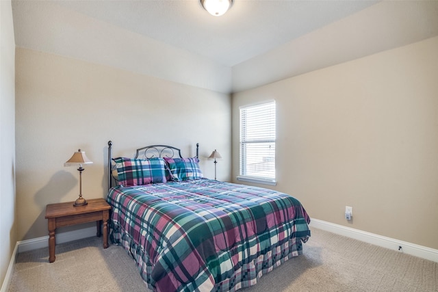 bedroom featuring carpet and baseboards