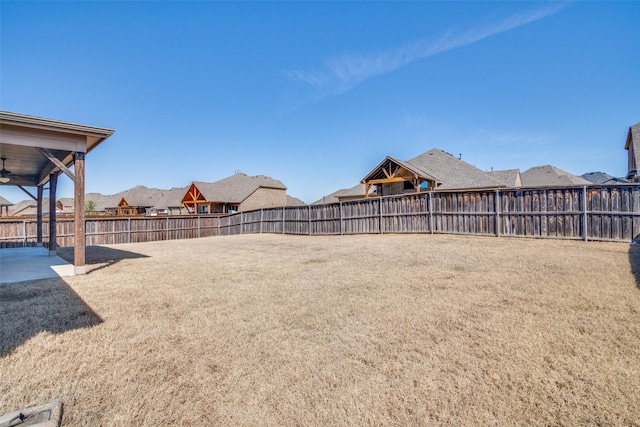 view of yard featuring a patio area and a fenced backyard