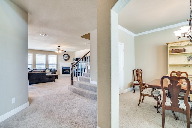 dining area featuring stairs, carpet floors, visible vents, and baseboards