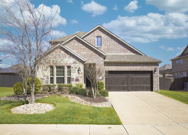 view of front of house with concrete driveway, brick siding, stone siding, and a front lawn