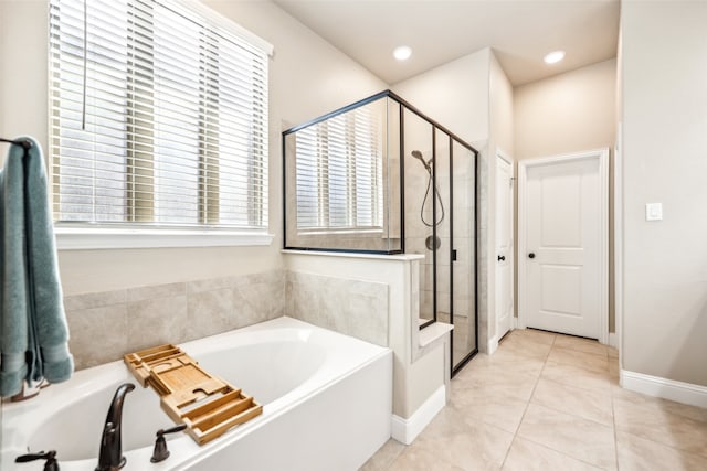 full bathroom with tile patterned flooring, recessed lighting, baseboards, a shower stall, and a bath