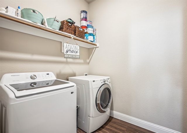 laundry area featuring laundry area, baseboards, dark wood-style floors, and separate washer and dryer