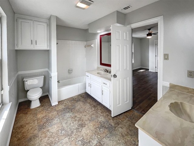 full bath featuring toilet, visible vents, vanity, a shower, and a bathtub