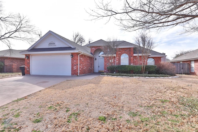 ranch-style house featuring driveway, a garage, and brick siding