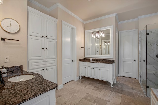 bathroom featuring a sink, a marble finish shower, two vanities, and crown molding