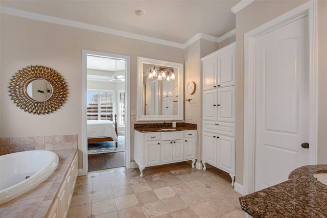 full bathroom featuring baseboards, a garden tub, ornamental molding, ensuite bathroom, and vanity