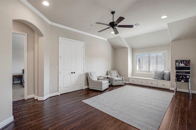 unfurnished room with arched walkways, visible vents, dark wood-type flooring, and baseboards