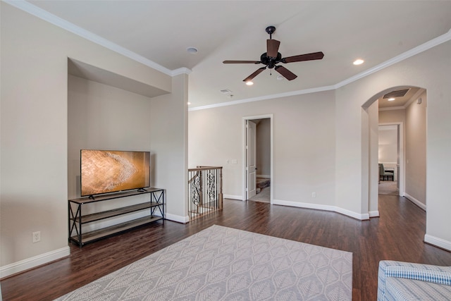 sitting room featuring visible vents, arched walkways, baseboards, and wood finished floors