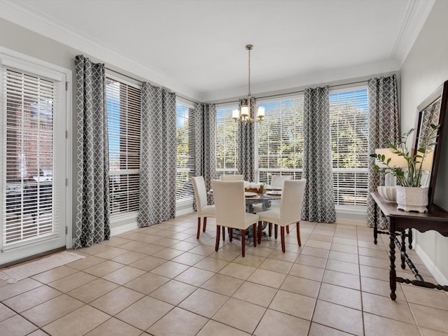 dining space with light tile patterned floors, a chandelier, and crown molding