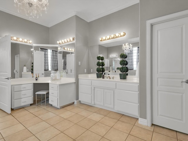 bathroom featuring tile patterned floors, two vanities, a sink, an inviting chandelier, and crown molding