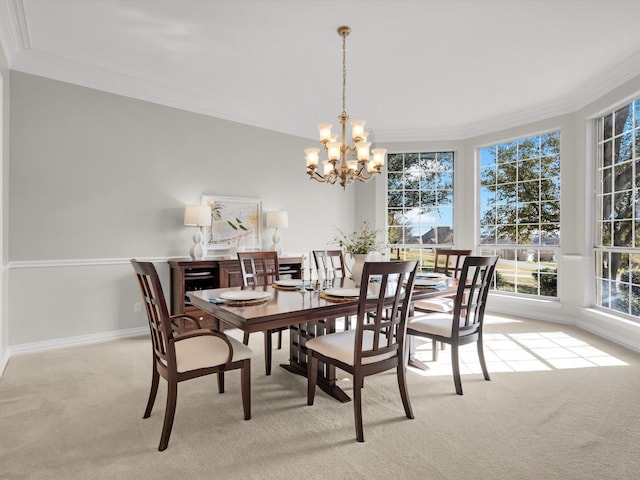 carpeted dining area featuring an inviting chandelier, crown molding, and baseboards