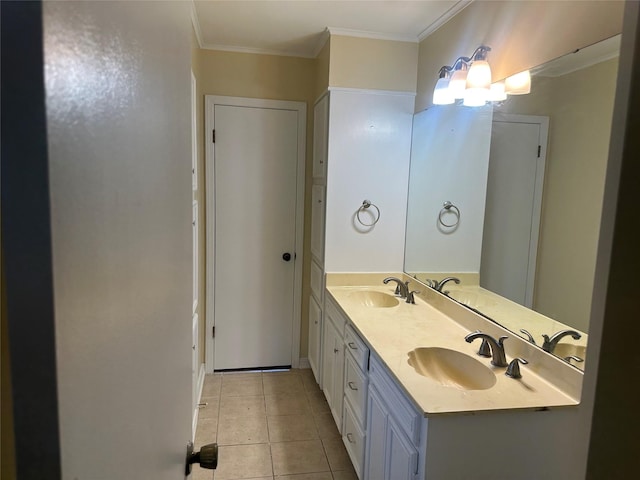 bathroom with double vanity, ornamental molding, a sink, and tile patterned floors