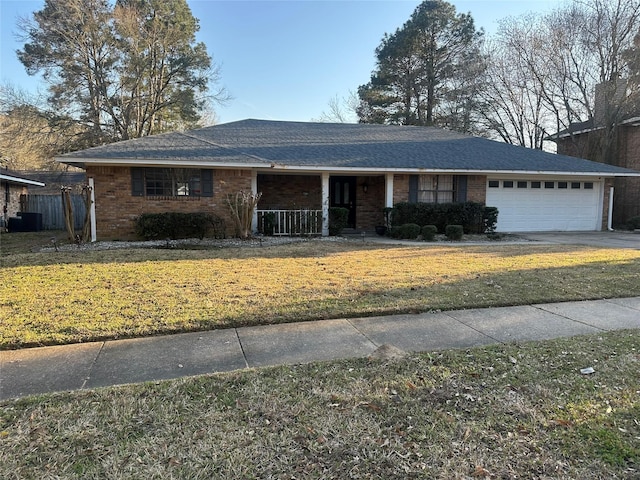 ranch-style house featuring a garage, cooling unit, a front lawn, and concrete driveway