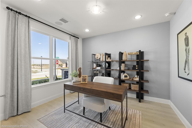 home office featuring light wood-style floors, visible vents, baseboards, and recessed lighting