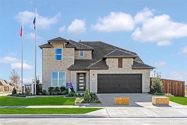 view of front of house with a garage, a shingled roof, concrete driveway, a front lawn, and brick siding