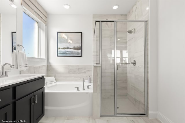 full bathroom featuring recessed lighting, a garden tub, a shower stall, and vanity