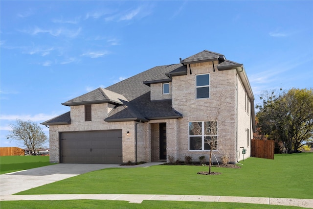 view of front of home with driveway, a front lawn, a shingled roof, and brick siding