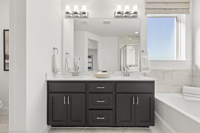 full bathroom featuring a sink, visible vents, a shower stall, a bath, and double vanity