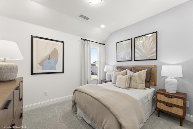 bedroom featuring light carpet, baseboards, visible vents, and vaulted ceiling