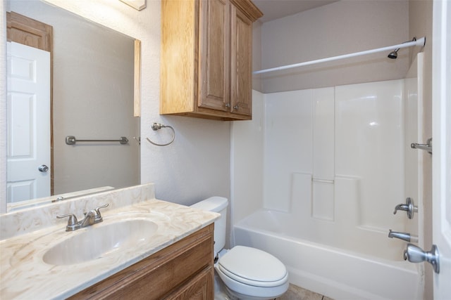 bathroom with toilet, shower / bathtub combination, and vanity