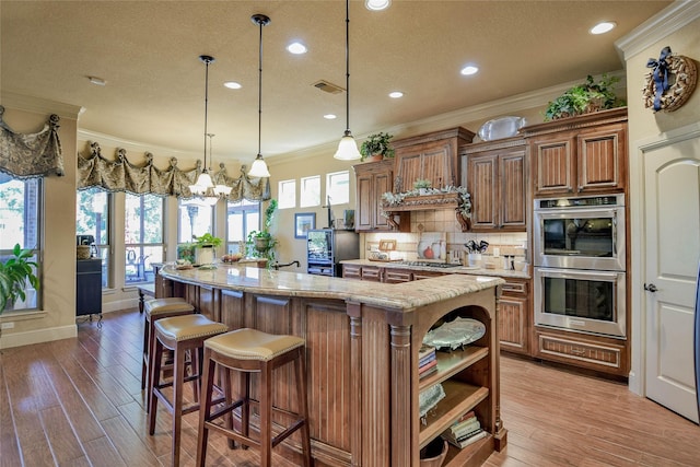 kitchen with crown molding, light wood finished floors, open shelves, tasteful backsplash, and appliances with stainless steel finishes