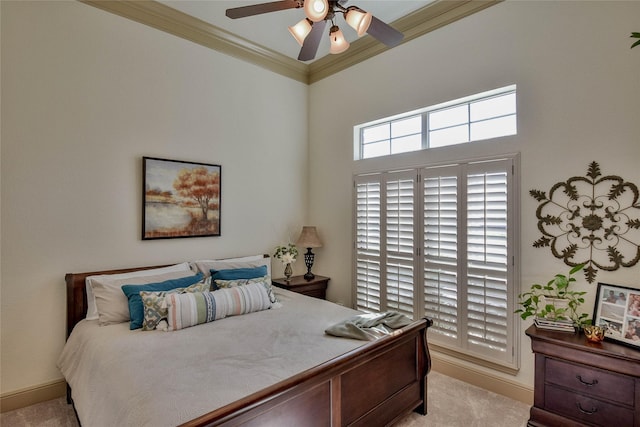 bedroom with a ceiling fan, carpet, baseboards, and crown molding