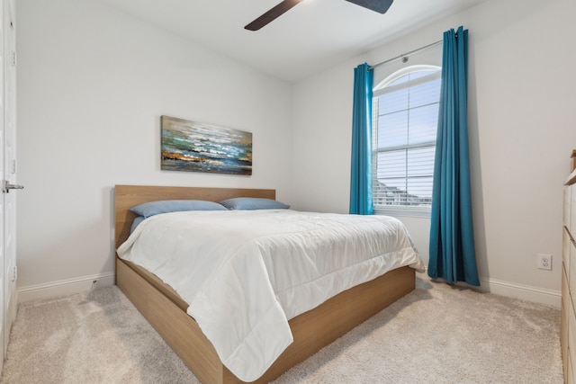 bedroom with carpet floors, ceiling fan, and baseboards